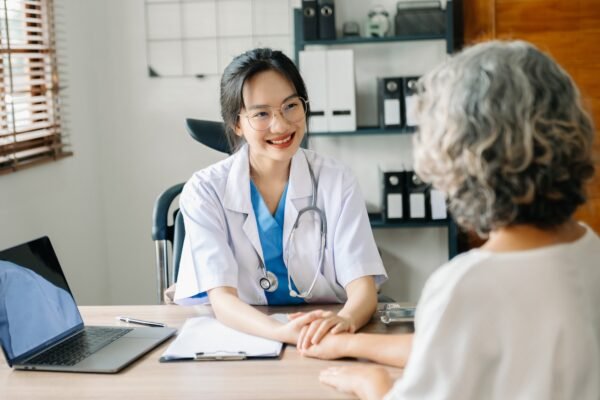 The doctor holds the patient’s. hand Healthcare and medical concept. The doctor holds the patient’s. hand Healthcare and medical concept.