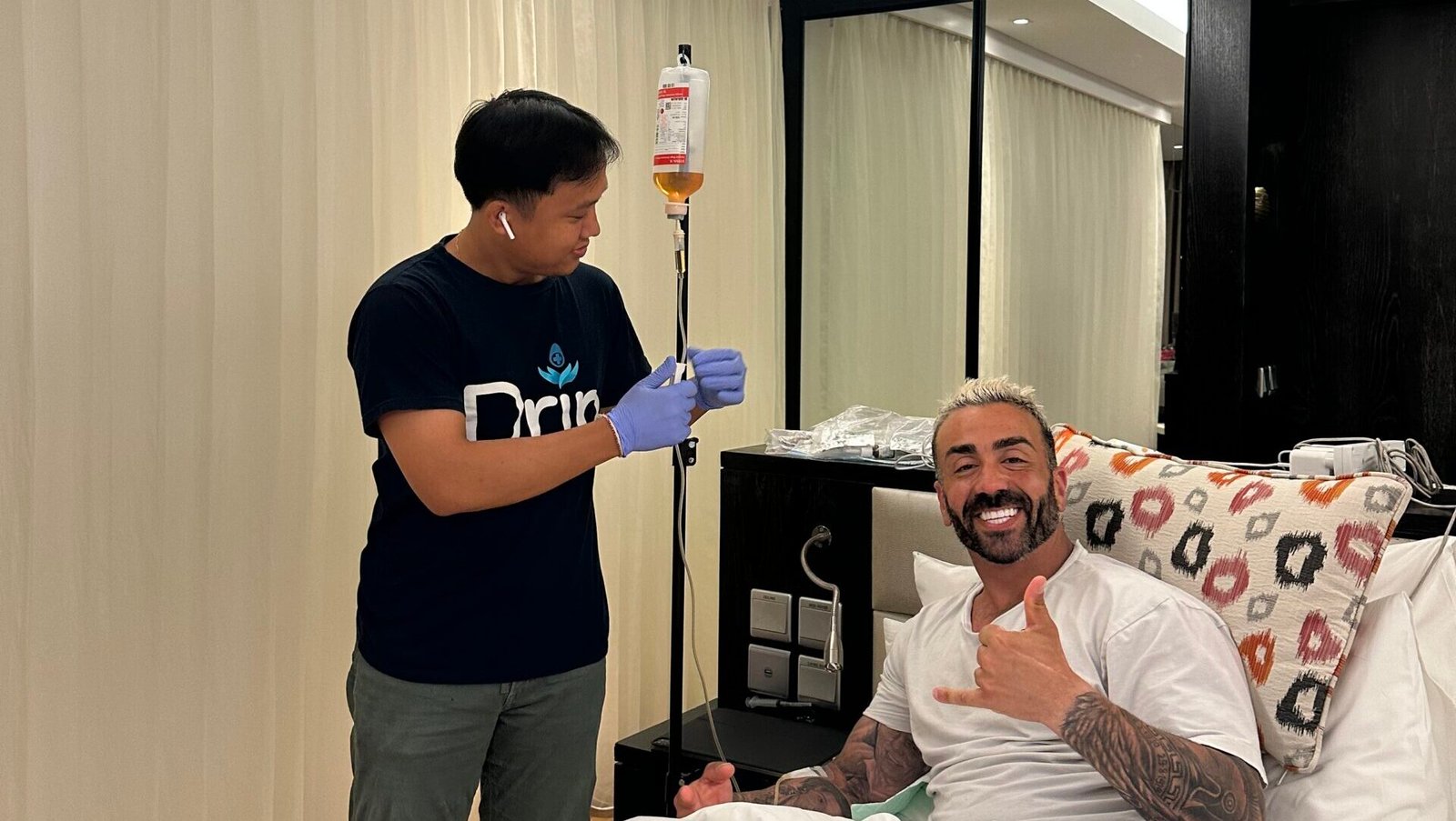 Patient receiving IV drip therapy at hotel with Drip Medical Clinic staff